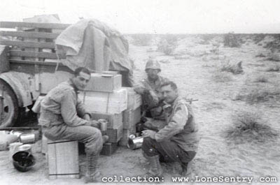 [11th Armored Division Training: Major Davenport - My Buddy, Capt Thigpen - Glasses, Lt. Brenman - With Cup]