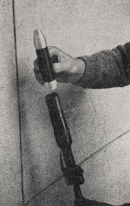 [Figure 15. Method of inserting rifle grenade. (The cup of the launcher being rifled, the grenade is inserted with a twisting motion.)]