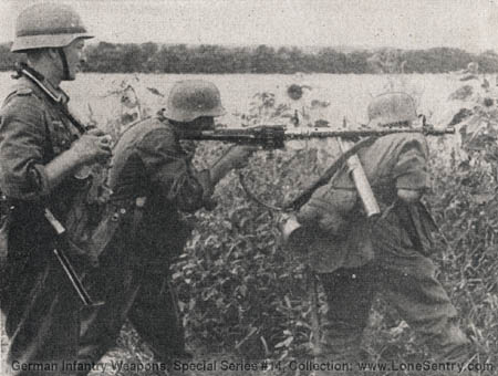 [Figure 32. M.G. 34 in action without bipod or tripod.]