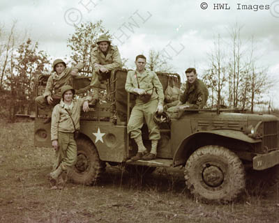 [WWII Color Photograph: Soldiers of 734th FA with truck.  Copyright HWL Images.]