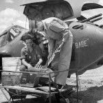 Ammunition for the 20mm nose gun in the Lockheed P-38 Lightning Babe is inspected. (U.S. Air Force Photograph)