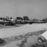 Destroyed Italian aircraft, including several Macchi C.202 Folgore fighters, at the edge of an airfield in Tunisia. (U.S. Air Force Photograph.)