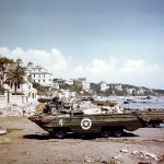 Color photograph of U.S. Army DUKW amphibious trucks on the beach at Anzio, Italy during Operation Shingle, April 1944. (Official U.S. Navy Photograph.)