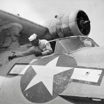 Mechanics perform maintenance work on a PBY flying boat at NAS Seattle, April 1944. (U.S. Navy Photograph.)