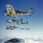 Color photograph of a formation of Royal Air Force North American Harvard IIAs flown by RAF trainee pilots over Rhodesia, January 1943. (Imperial War Museum Photograph.)